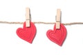 Two red hearts on clothespins on white background - Valentine`s day concept Royalty Free Stock Photo