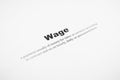 Closeup of a typed definition of the word wage. Royalty Free Stock Photo