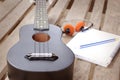 Closeup ukulele on a wooden floor. Royalty Free Stock Photo