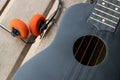 Closeup ukulele on a wooden floor. Royalty Free Stock Photo