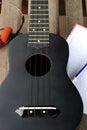 Closeup ukulele on a wooden floor. Royalty Free Stock Photo