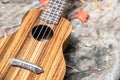 Closeup ukulele on wooden table Royalty Free Stock Photo
