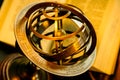 Closeup of a unique vintage golden armillary sphere. Royalty Free Stock Photo