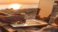 Closeup of unrecognizable digital nomad typing on laptop at the beach showcasing the concept of making money online