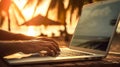 Closeup of unrecognizable digital nomad typing on laptop at the beach showcasing the concept of making money online