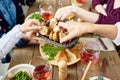 People Passing Bread at Dinner Table Royalty Free Stock Photo