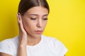 Closeup up side profile sick female having ear pain touching her painful head Royalty Free Stock Photo