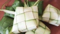 Closeup up white and green ketupat ramadan background. Ketupat frame of Idul Fitri traditional. Eid mubarak theme.