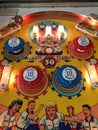 Closeup of upper playfield pop bumpers on vintage pinball Bowling Queen