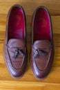 Closeup Upper View of Two Pair of Traditional Formal Stylish Brown Pebble Grain Tassel Loafer Shoes