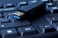 Closeup of USB memory stick resting on computer keyboard Royalty Free Stock Photo