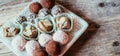 Traditional homemade Christmas cookies: Variety of sweet European cookies on rustic wooden desk, powdered sugar