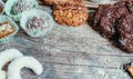 Traditional homemade Christmas cookies: Variety of sweet European cookies on rustic wooden desk, powdered sugar