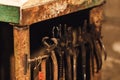 Closeup of various blacksmith tongs.