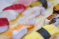 Closeup on various pieces of Japanese sushi or rice hand-pressed nigirizushi.