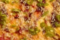 Closeup of vegan pizza with soy sausage, melted vegetarian mozzarella and jalapeno Royalty Free Stock Photo