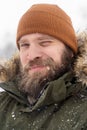 Closeup vertical portrait of young man in khaki winter jacket Royalty Free Stock Photo