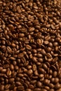 Closeup vertical shot of freshly-roasted coffee beans Royalty Free Stock Photo