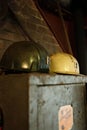 Closeup vertical shot of the miner's helmets on an old locker in a mine in the Ruhr area, Germany Royalty Free Stock Photo