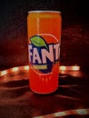 Closeup vertical shot of an orange Fanta can covered with water droplets Royalty Free Stock Photo