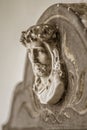 Closeup vertical shot of a sculptured image of Christ with a blurred background Royalty Free Stock Photo