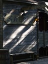 Closeup vertical shot of a wooden saloon with sunlight reflections