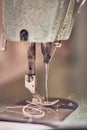 Closeup vertical shot of a working sewing machine Royalty Free Stock Photo