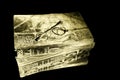 Closeup very old spectacles eyes glasses on very old gold book lying on mirror for reflection Royalty Free Stock Photo