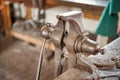 A closeup of an old vise in a workshop. Royalty Free Stock Photo