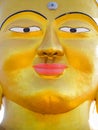 Closeup vibrant gold Shanti Ban Buddha face, golden Buddha`s image in Dhulikhel, Nepal Royalty Free Stock Photo