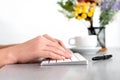 Closeup video of female hands, typing on the PS keyboard, at the table in the office