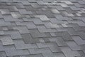 Closeup view on Asphalt Roofing Shingles Background. Roof Shingles - Roofing.