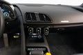 Closeup view of an Audi R8 black interior with a modern dashboard