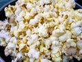 A closeup view of bowl of popcorn on a wooden table