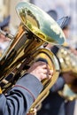 Closeup view of brass tuba in hands of musician Royalty Free Stock Photo