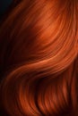 A closeup view of a bunch of shiny straight red hair in a wavy curved style.