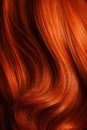 A closeup view of a bunch of shiny straight red hair in a wavy curved style.