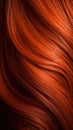 A closeup view of a bunch of shiny straight red hair in a wavy curved style.