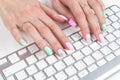 Closeup view of a business woman hands typing on wireless computer keyboard on office table. Royalty Free Stock Photo