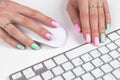 Closeup view of a business woman hands typing on wireless computer keyboard on office table. Soft lightning. Royalty Free Stock Photo