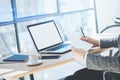 Closeup view of businessman in eyeglasses working at office on laptop while sitting at the wooden table.Coworker anazyle Royalty Free Stock Photo