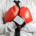 Businessman wearing red boxing gloves Royalty Free Stock Photo