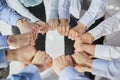 Hands, teamwork and motivation with a team of business people joining their fists in a huddle or circle. Royalty Free Stock Photo