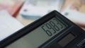 Closeup view calculator display with calculations. Numbers appearing on screen. Royalty Free Stock Photo