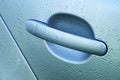 Closeup view of car door handle with water drops Royalty Free Stock Photo