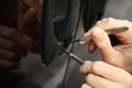 Closeup view of carjacker trying to open car Royalty Free Stock Photo