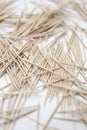 Chaotic pile of toothpicks on a white background