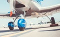 Closeup view of chassis of shiny blue sport plane