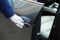 Closeup view of chauffeur opening car Royalty Free Stock Photo