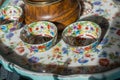 Closeup view of the colorfully designed small bowls on a tray